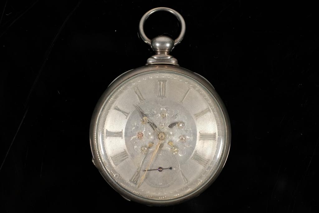 F. Adams & Son Fancy Open Face Pocket Watch: F. Adams & Son fancy open face key wind pocket watch.The back interior cover engraved 27579,ARGENT, 2561.Dust cover engraved F. Adams & Son/CORNHILL/ London/HANDS/No 2561/PATENT LEVER/FULL JEWELLED.