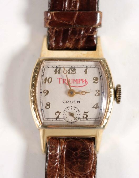 Gruen Mens Gold Triumph Watch: Mens Gruen Triumph watch. Gold plated on alligator band.
