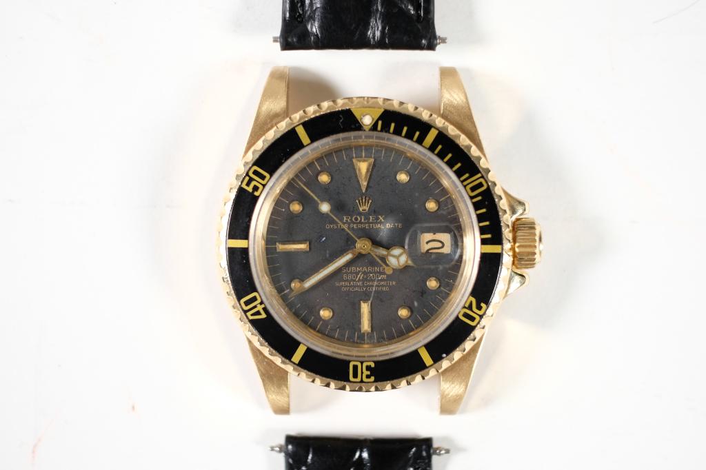 Vintage 18k YG Rolex 1680 Submariner Watch: Vintage 18k yellow gold Rolex Submariner 1680 with nipple dial and leather band. Case weighs 54.80 grams