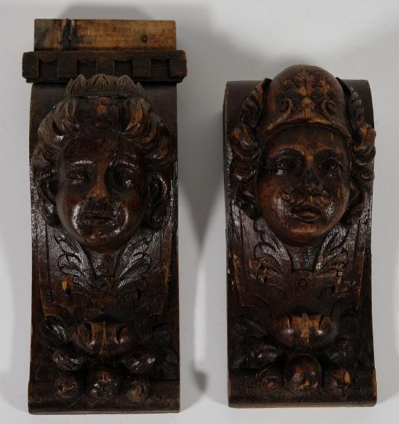 Two Continental Carved and Stained Wood Corbels: Two Continental carved and stained wood corbels with masks. Approx. height of tallest 10" x 3.5".