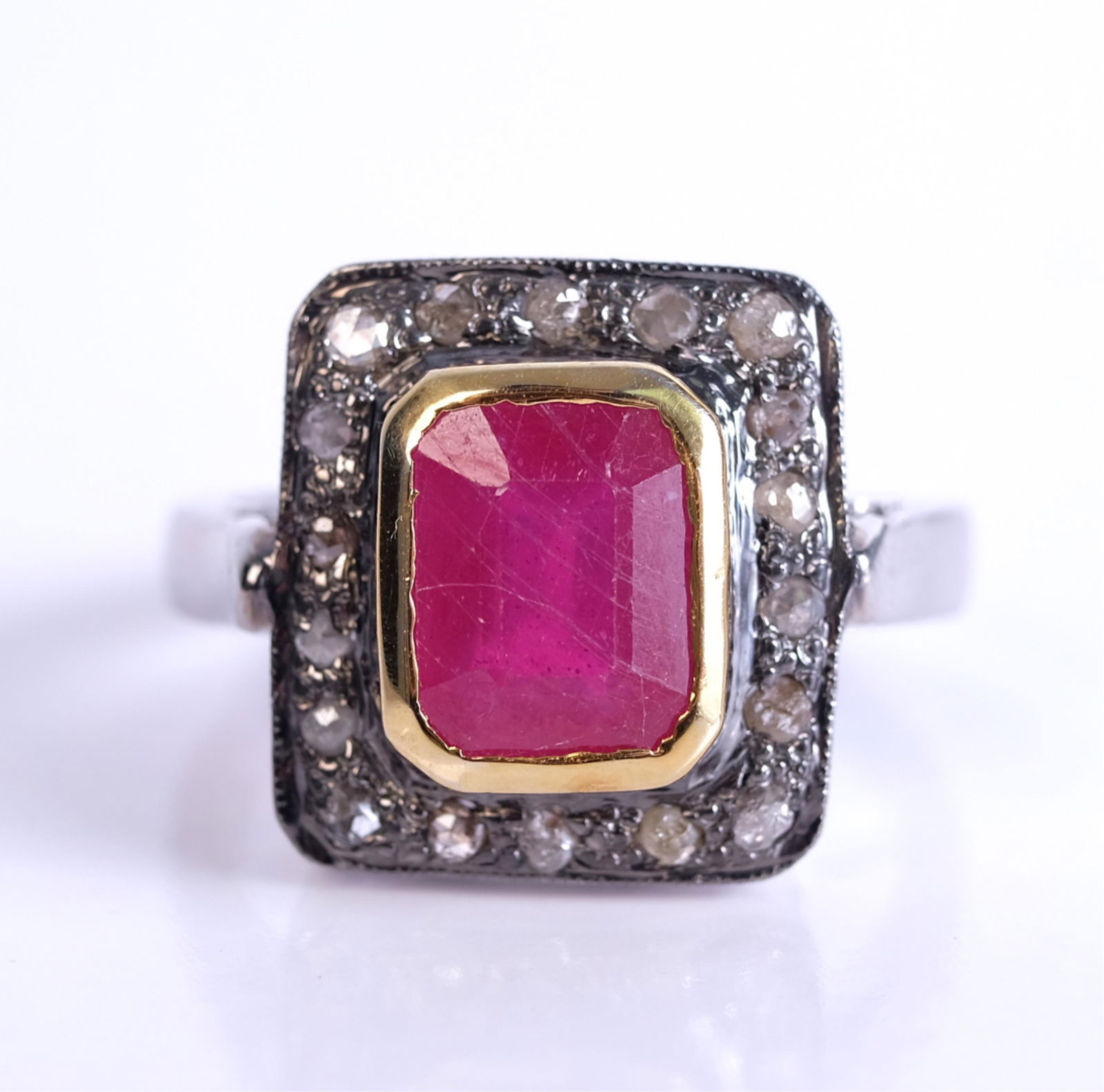 Sterling Silver Ruby and Diamond Ring: Sterling silver ruby and diamond ring. Size 7 1/2. Stamped 925. Approx. overall weight 5.55 grams.