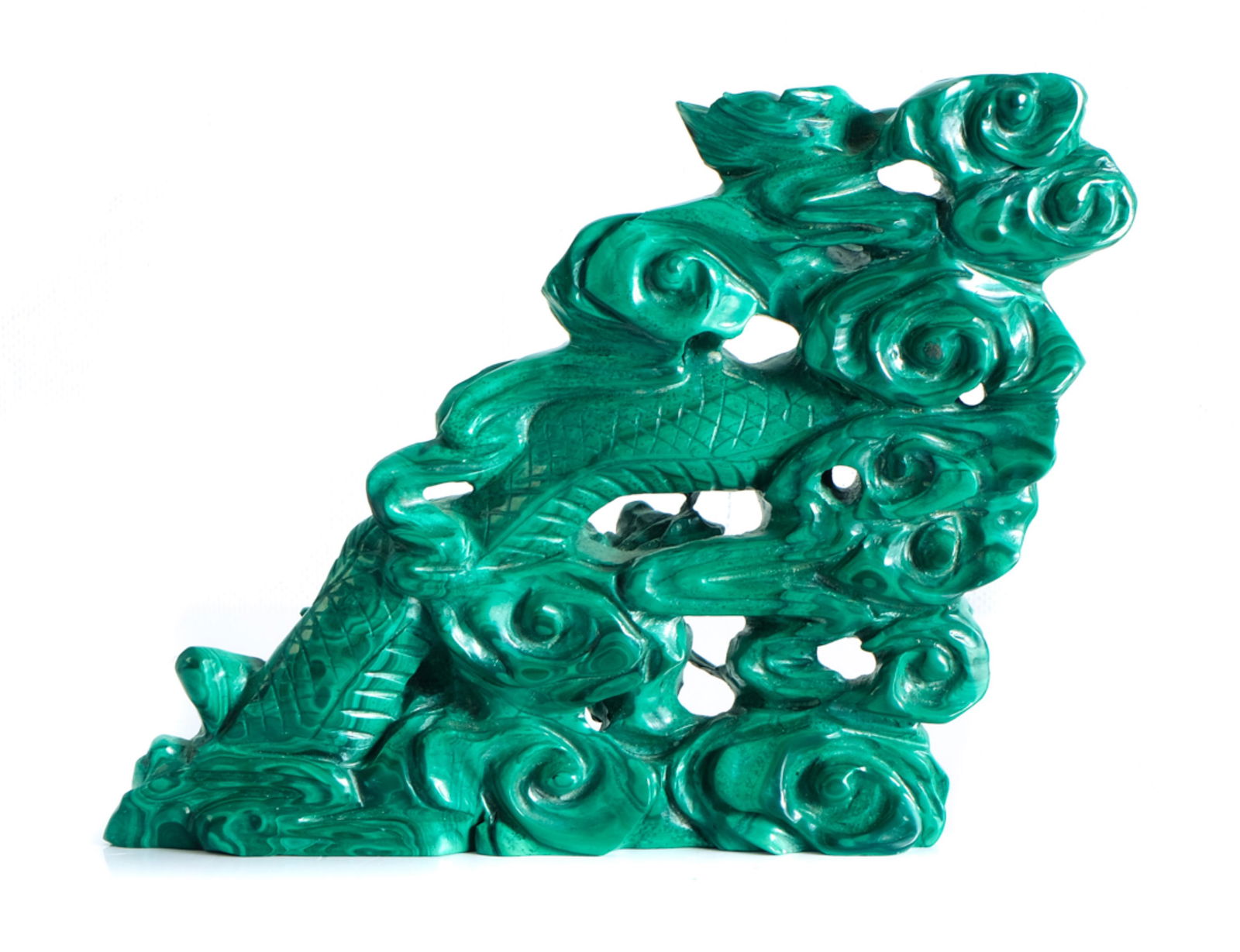 Chinese Carved Malachite Sculpture of a Dragon: Chinese carved Malachite sculpture of a dragon chasing the flaming pearl. Approx. height 4.75", base width 5". Provenance: From the Collection of a prominent dignitary from Atlanta, Georgia.