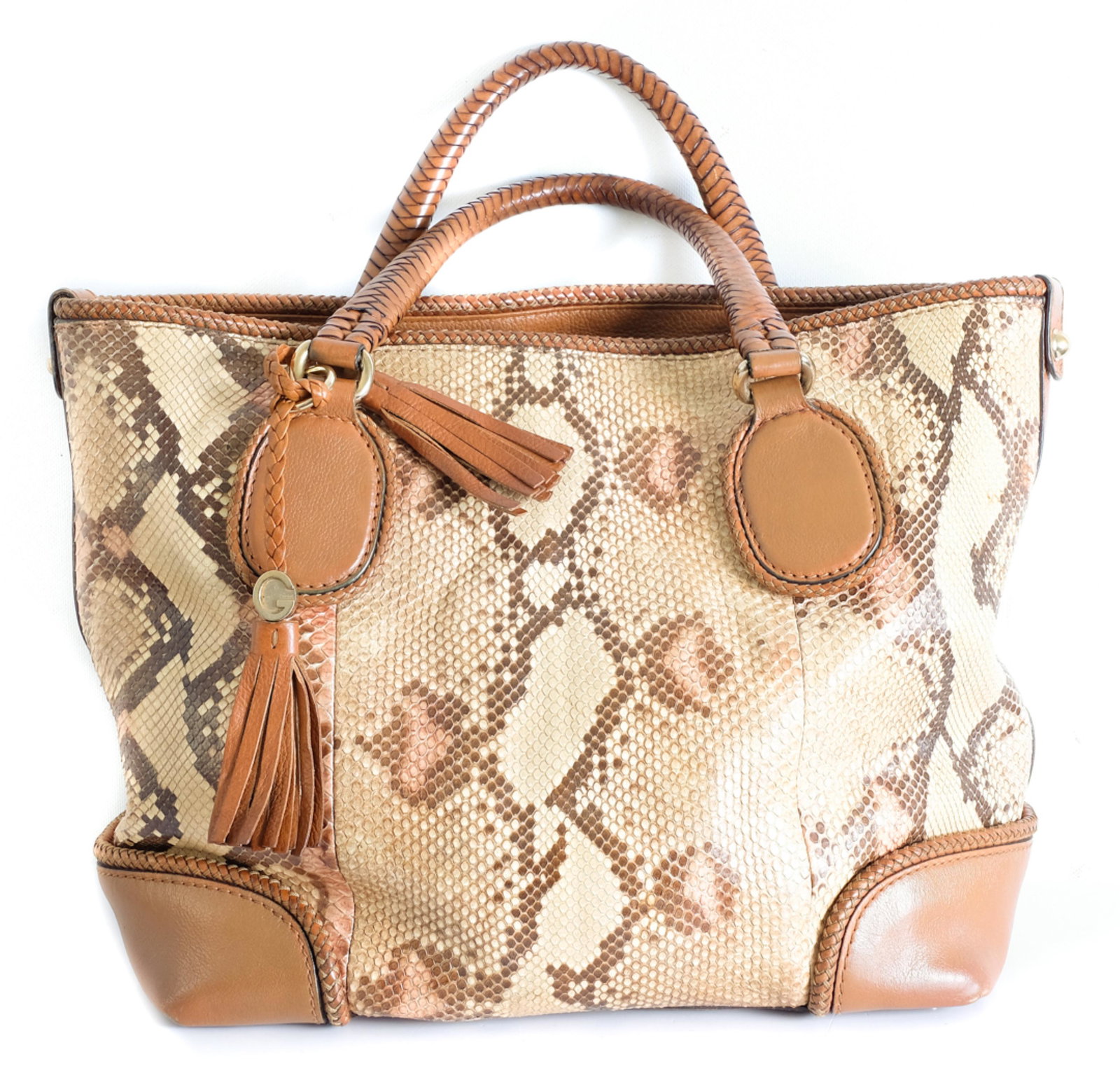 Like New Gucci Snakeskin Tote Bag: Amazing and rare like new Gucci snakeskin tote bag with braided leather tooling and handles. Note, there is slight slight wear in the gold tone hardware, otherwise this bag is in like new condition. M