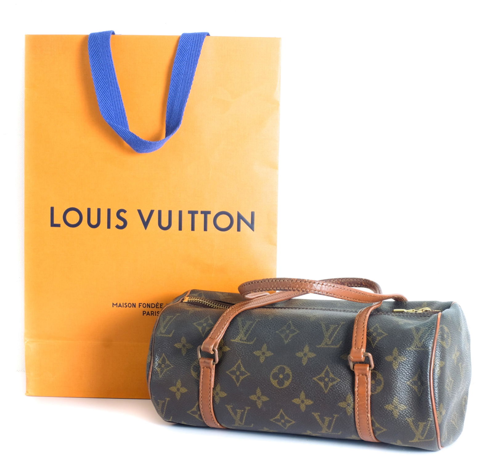 Louis Vuitton Monogram Papillon 26: Louis Vuitton Monogram Papillon 26 with LV bag. This barrel-style handbag is crafted of signature Louis Vuitton monogram on coated canvas. It features vachetta cowhide leather piping, and trim that ex