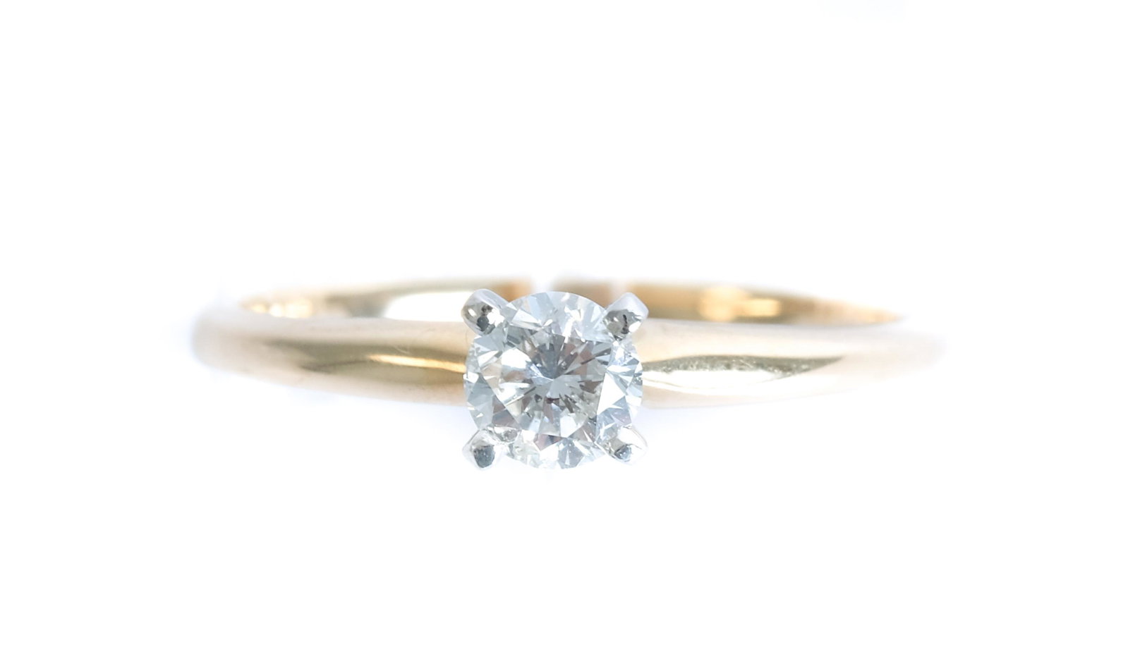 14k YG Diamond Solitaire Engagement Ring Size 5: 14k yellow gold diamond solitaire engagement ring having a round brilliant center diamond. Ring size 5. Stamped 14k. Approx. overall weight 1.57 grams.