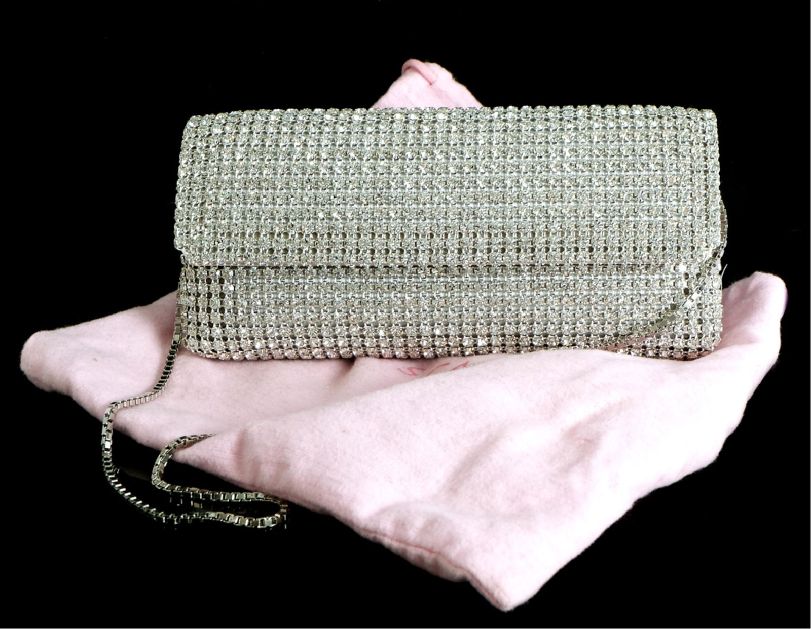 Escada Silver Swarovski Crystal Flap Clutch Bag: Escada silver Swarovski crystal flap clutch bag with chain. Fully Embellished with Swarovski crystals. Snap closure, Interior satin lining with logo ESCADA in crystals. One interior flat pocket. Comes