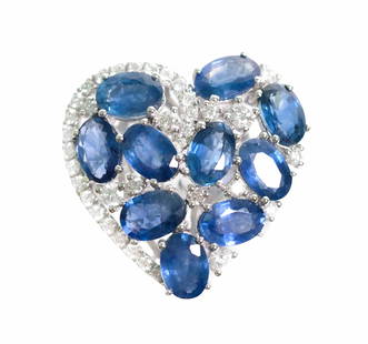 14k WG 6ct Sapphire & Diamond Heart Shaped Ring: 14k white gold heart shaped ring set with 6.00ct oval blue Sapphires and 0.60ctw round white diamonds. Ring size 7. Hallmarked 14k SD. Approx. overall weight 5.3 grams.