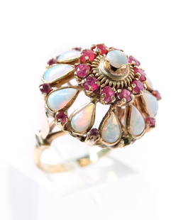Vintage 18k YG Opal Ruby Cluster Dome Ring: Vintage 18k yellow gold cluster dome ring set with round opal cabochon above ten round cut rubies, ten pear shaped opal cabochons flanked by nine round cut rubies (one ruby lacking). Ring size 5 