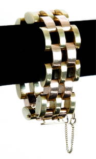 14k Tiffany & Co. Two Tone Gold Bracelet 92 grams: 14K gold Tiffany & Co. wide link bracelet with alternating rows of rose and yellow gold. Stamped on clasp 14K and Tiffany & Co. Approx. length 8". Approx. weight 92.3 grams. Note: missing safety 