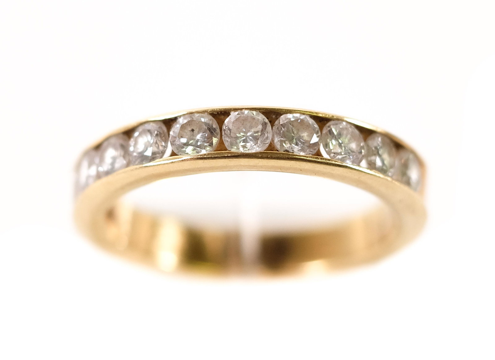 18k Yellow Gold Diamond Ring Band Size 6: 18k yellow gold ring band set with eleven round brilliant cut diamonds. Ring size 6. Hallmarked 18k AJA. Approx. overall weight 4 grams.