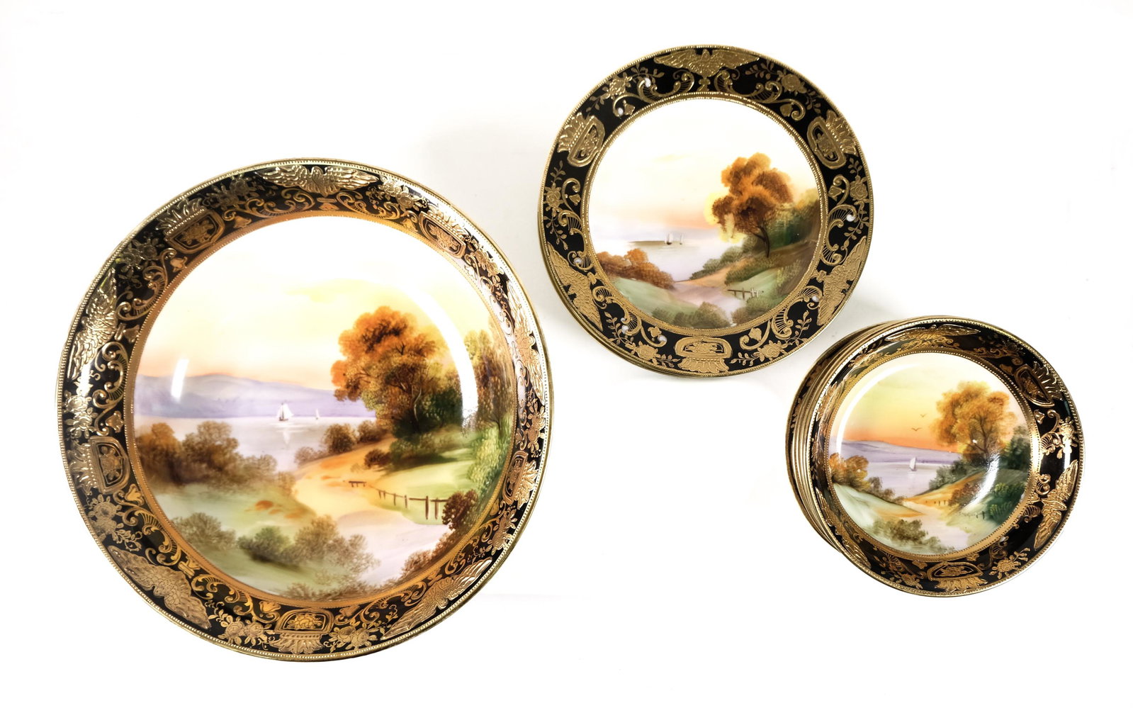 13 PC Nippon Scenic Porcelain Berry Dessert Set: Thirteen piece Nippon porcelain berry or dessert set comprising a serving bowl, six berry bowls with 6 underplates; all having central hand painted scenes of landscape with sailboats on the water at s