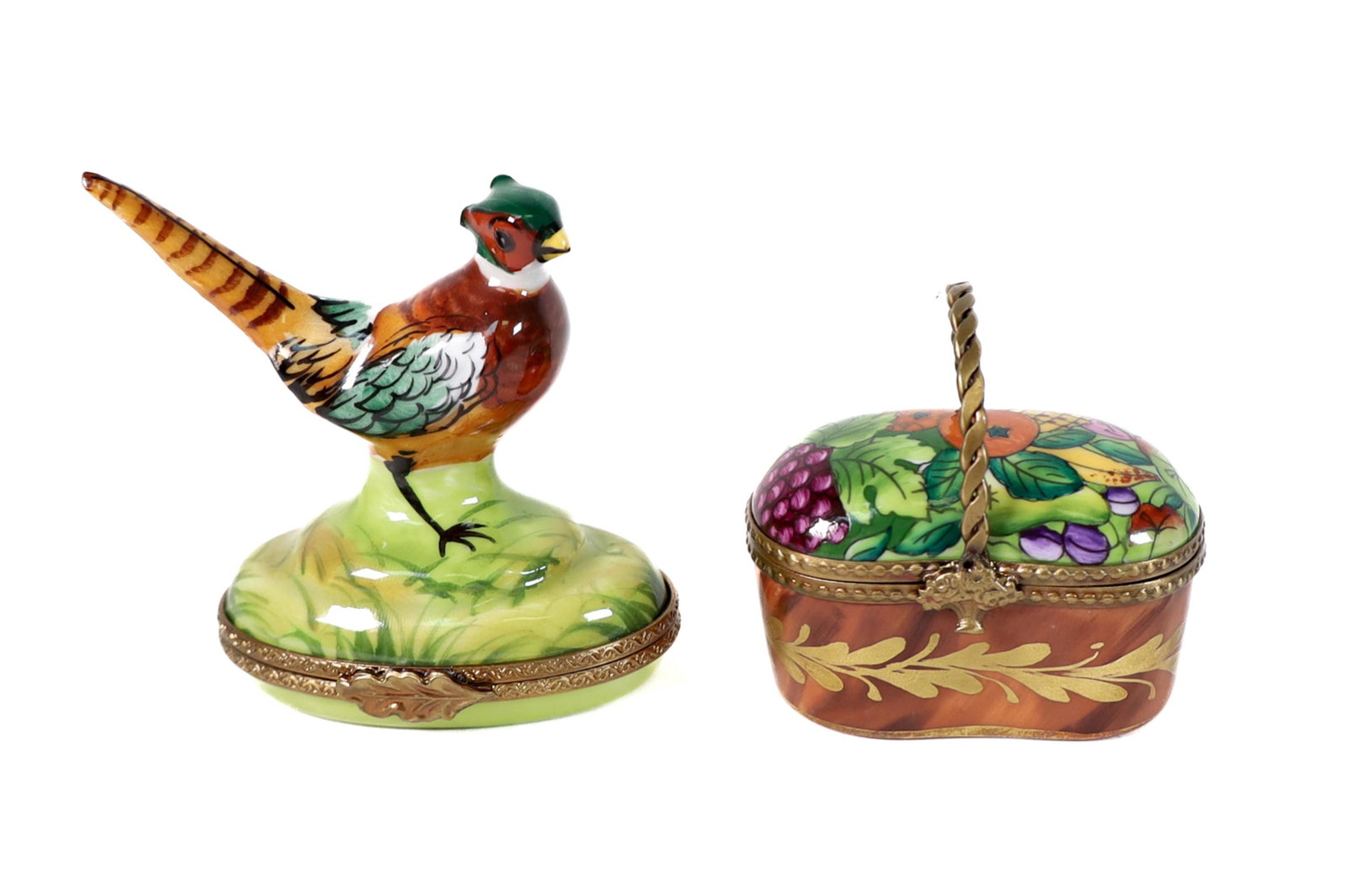 2 Limoges Porcelain Trinket Boxes: Two Limoges hand painted porcelain trinket boxes comprising of One (1) fruit basket, approx. 2in.; One (1) Pheasant, approx. 2.25in. Each stamped on bottom " Limoges France Marque Deposee Peint Main".