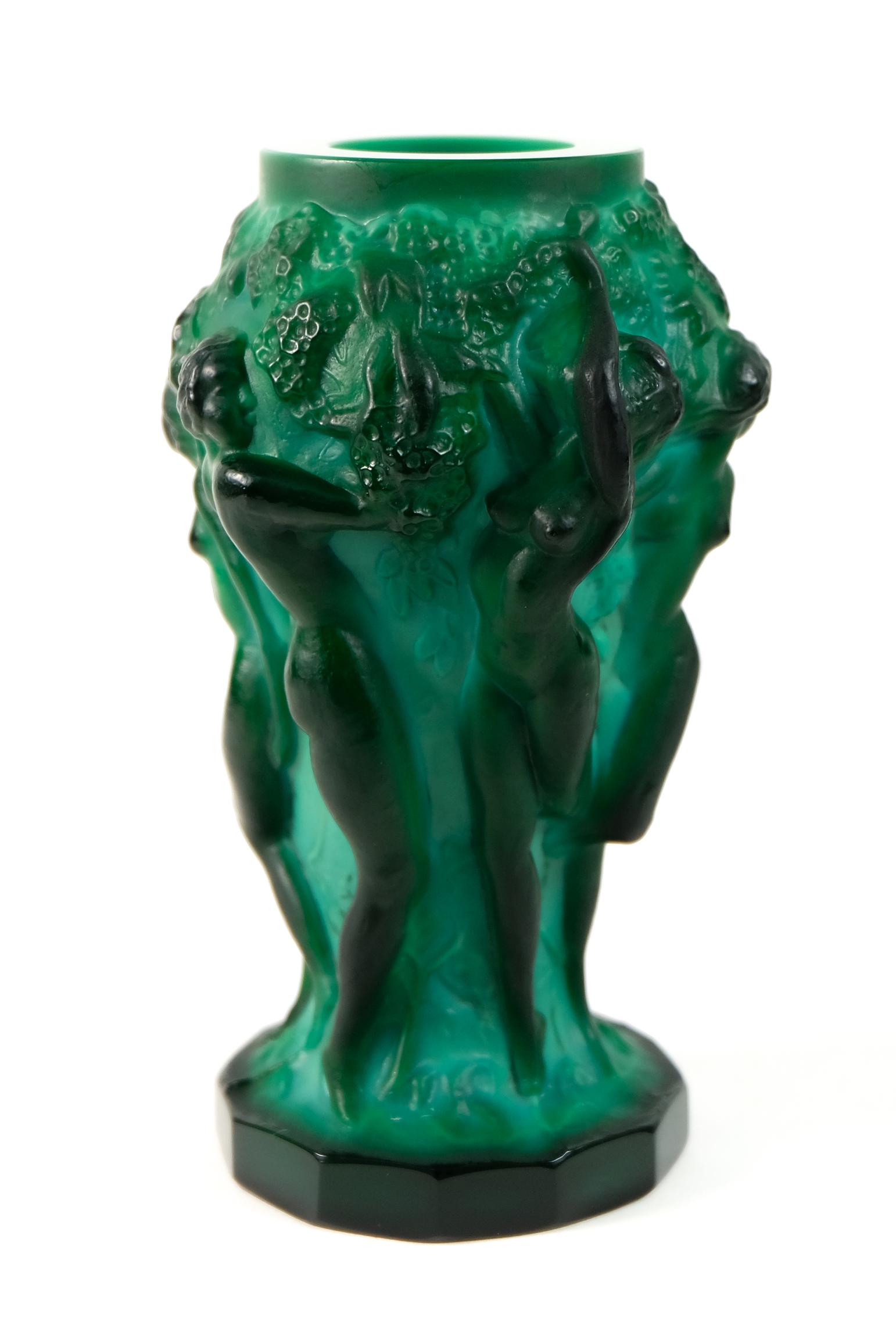Bohemian Czech Malachite Glass Harvest Vase: Bohemian Czech malachite glass Harvest Vase with raised nude figures of revealing bacchantes around the surface on a twelve sided base. Design by Frantisek Pazourek 1930s. Manufactured by Heinrich Hof