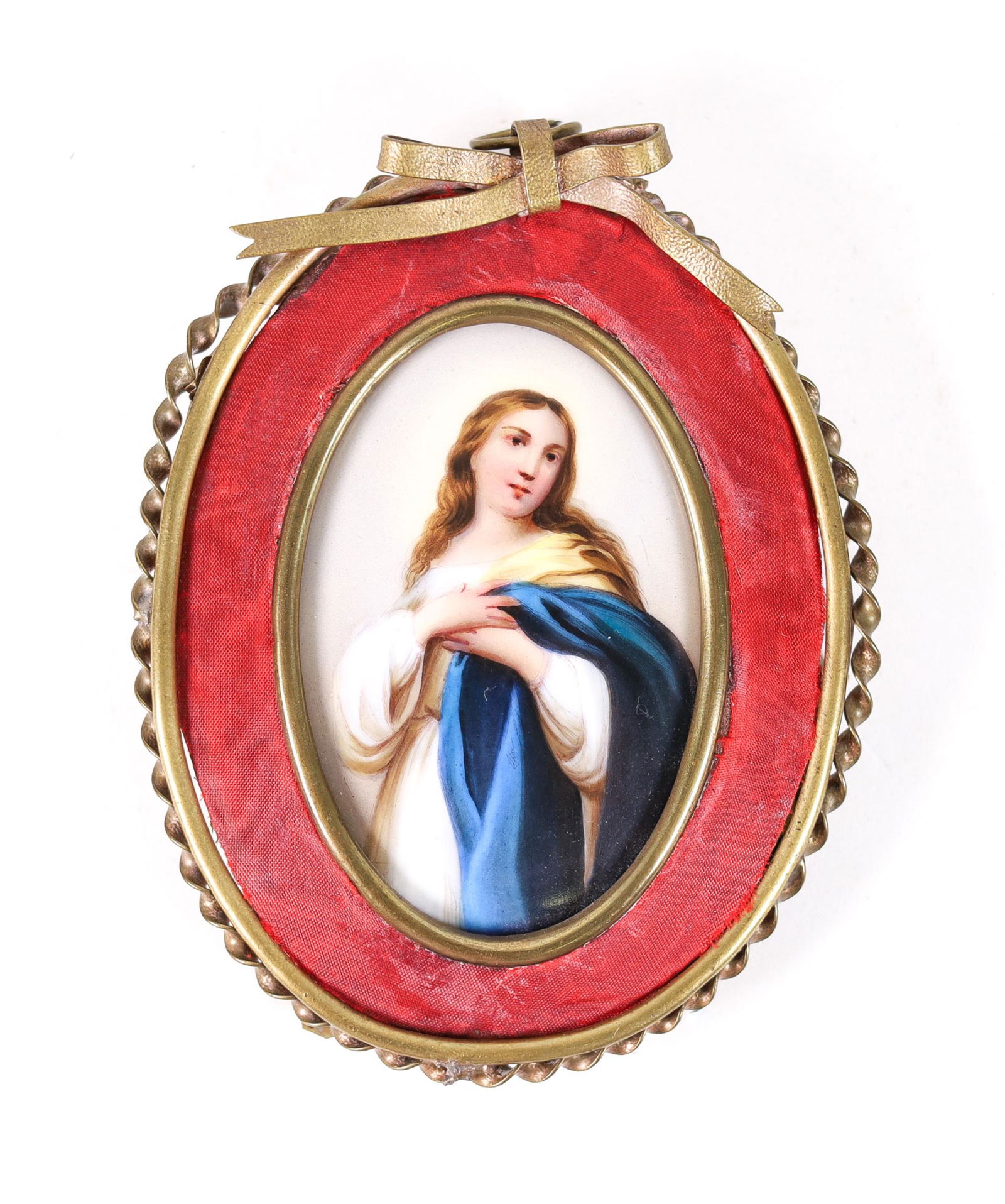 PORCELAIN PLAQUE OF MARY MAGDALENE AFTER MURILLO: Hand painted miniature porcelain oval plaque with the image of Mary Magdalene, likely after the painting by Bartolome Murillo. Presented in gilt metal ribbon tied frame, approx. 5 x 3.87 in.