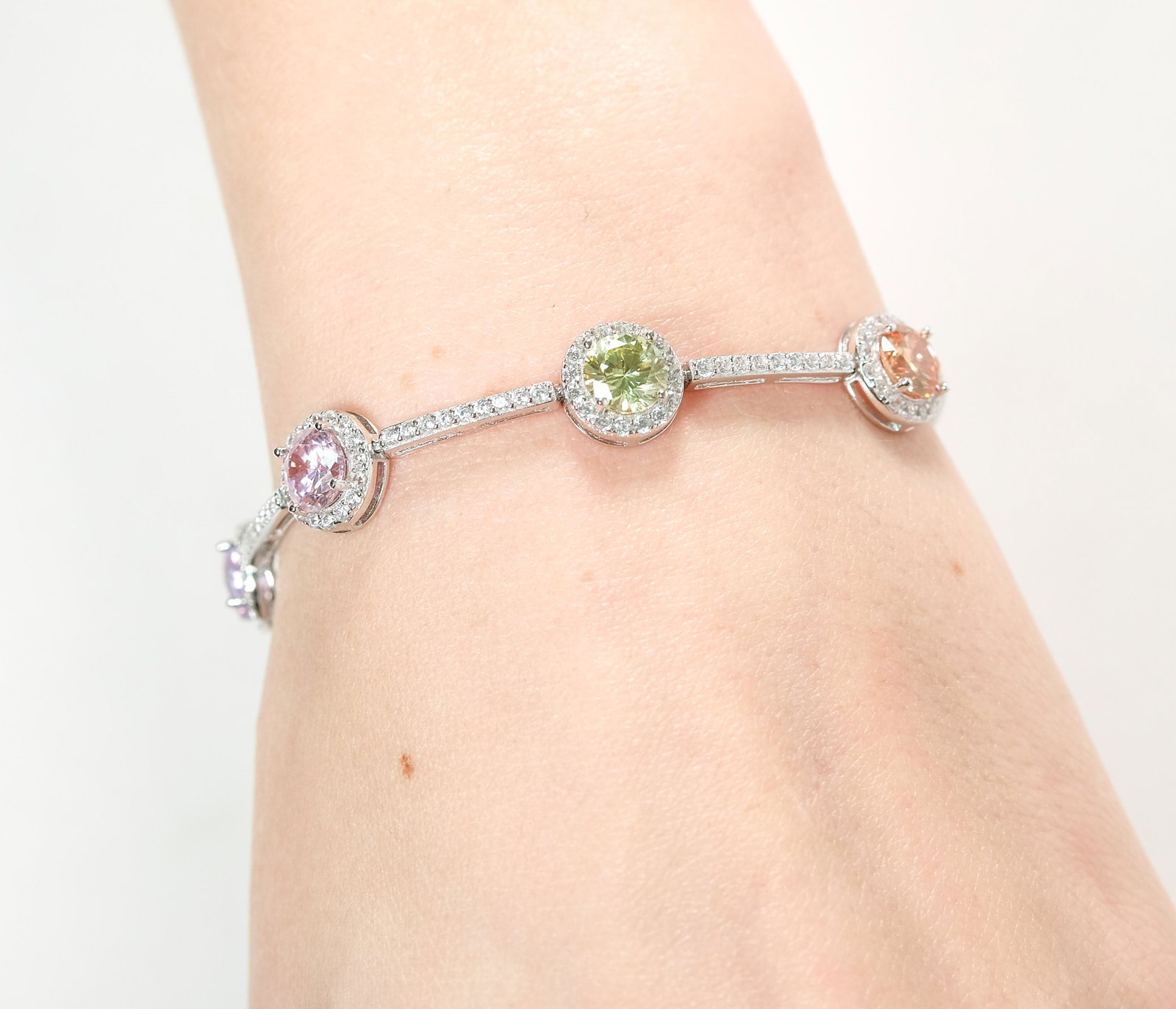 STERLING SILVER GEMSTONE BRACELET: Sterling silver bracelet having colored glass stones. Stamped 925 CN. Approx. length 7in., approx. weight 13 grams.