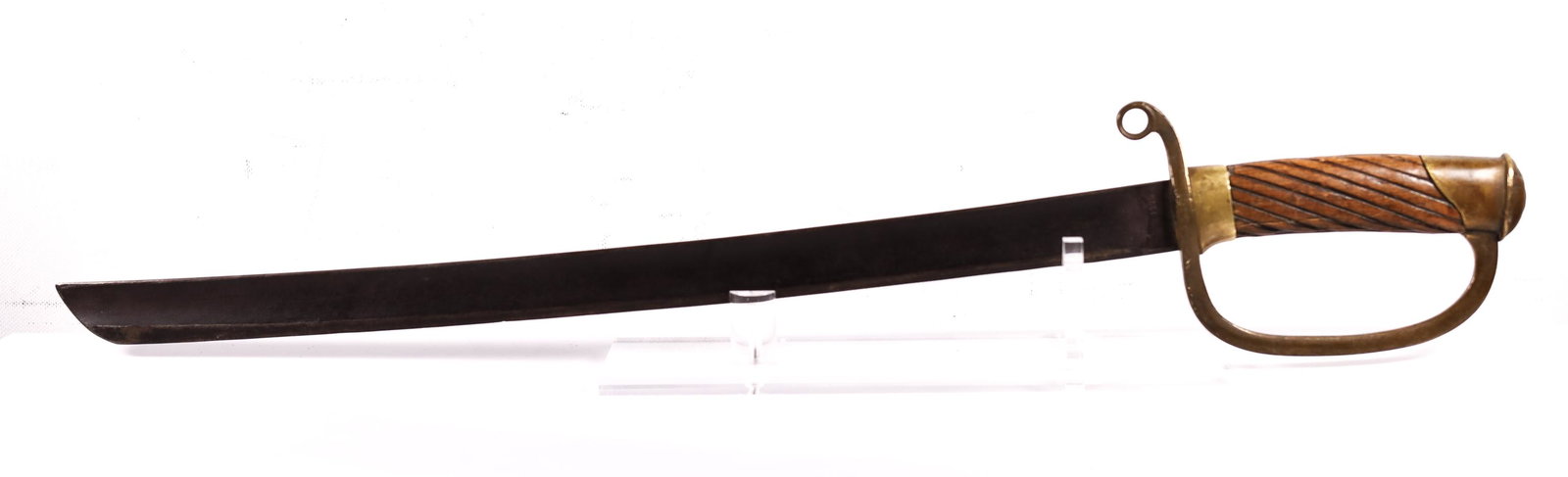 1905 English Curved Cavalry D-Hilt Sabre: Wood handle. Steel blade and bronze hilt. Ricasso marked "A, A, 55." Guard marked 507. Overall length: 25 inches. Blade measures 19 inches. Handle measures 5.75 inches.