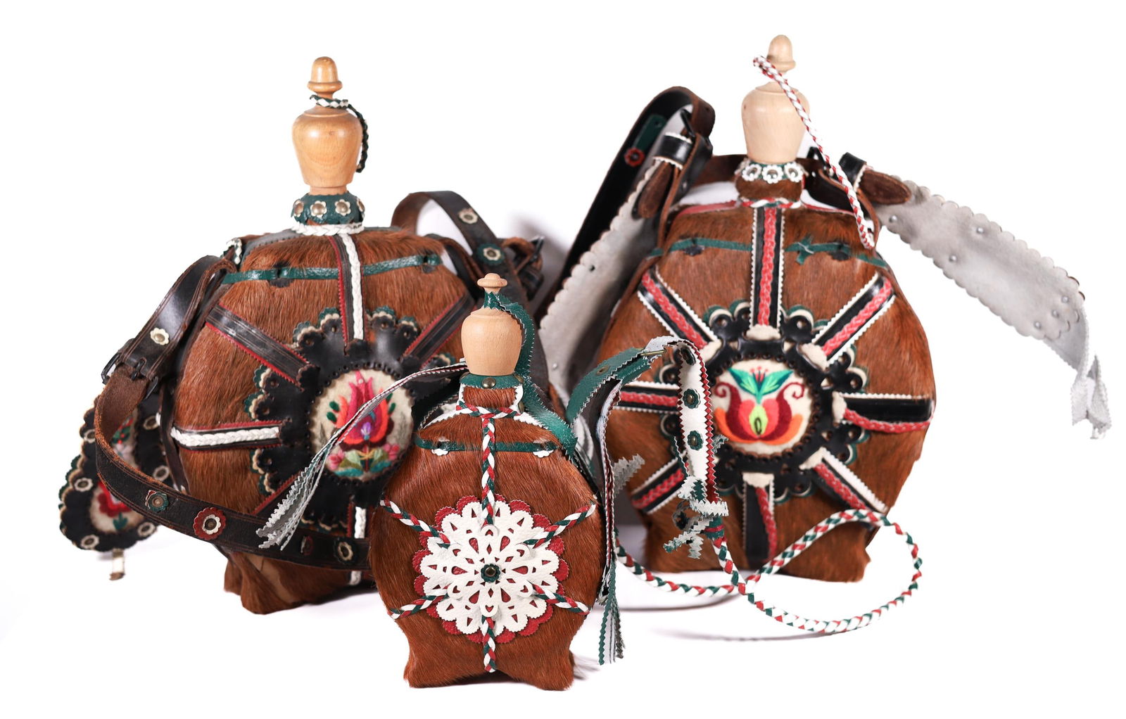 LOT OF 3 HUNGARIAN FOLK ART FLASKS: Lot of 3 handmade circular Hungarian folk art flasks made of horsehair, leather and wood with beautiful embroidered flowers. Popularly found in areas of Europe such as Hungary, Slovakia, Transylvania
