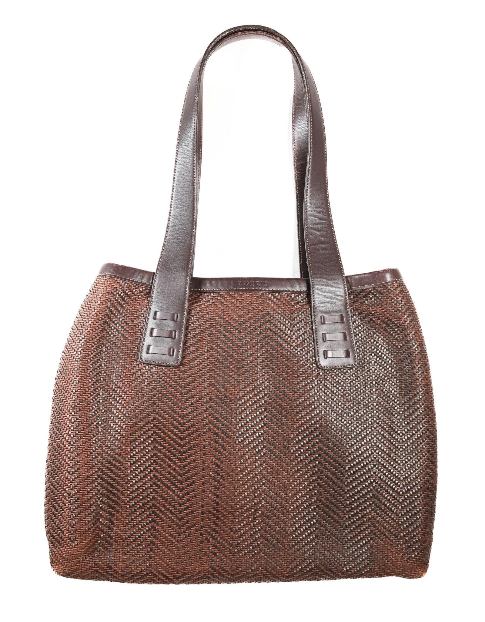 LOEWE BRAIDED LEATHER TOTE BAG 16.25 IN.: A Loewe leather tote bag. This brown bag features leather trim, handles, and a woven straw and leather design. The bag is in good condition, with only minor wear on the trim, edges, and handles. The i