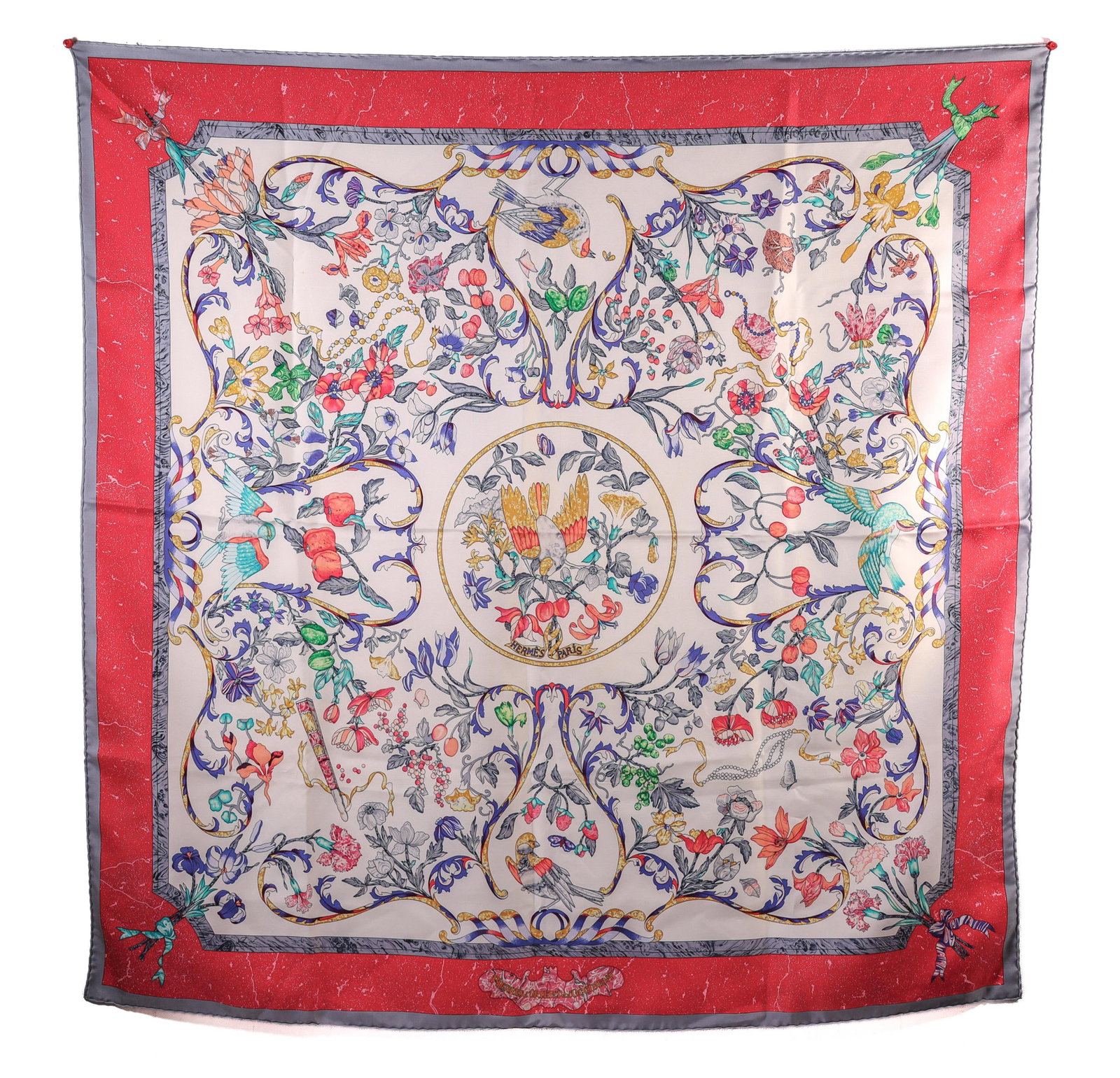 HERMES PIERRES D'ORIENT ET D'OCCIDENT SCARF: A Hermes Pierres d'Orient et d'Occident scarf in excellent condition. This scarf features a beautiful floral design with a red border. Details and measurements: Dimensions: 34 IN. X 34 IN.