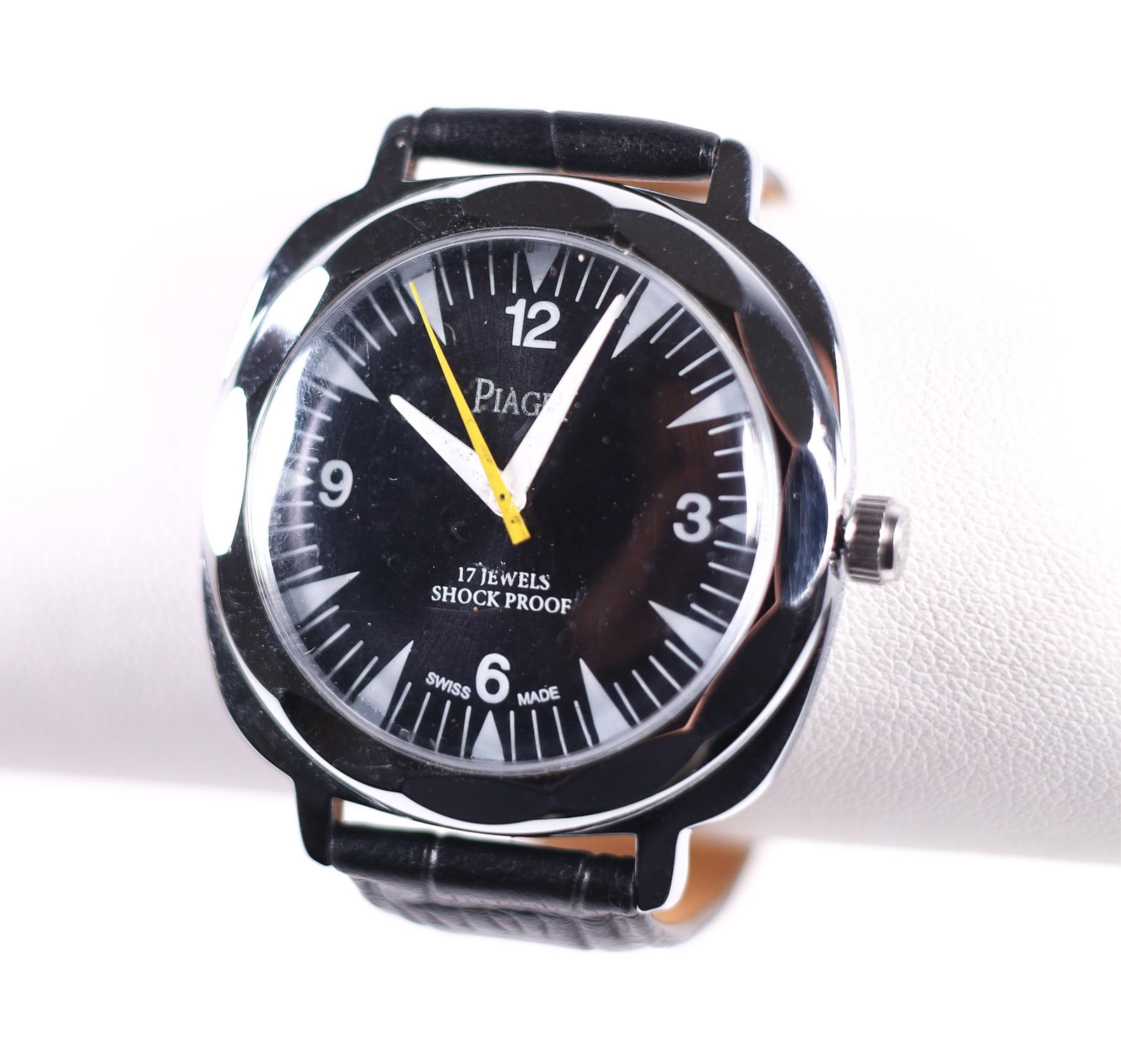 VTG PIAGET 17 JEWELS SHOCKPROOF MANUAL WATCH, 38MM: Vintage Piaget 17 Jewels Shockproof manual watch in good condition. It features a stainless steel case, a black dial, and a black leather band. Details and measurements: Diameter: 38 MM.