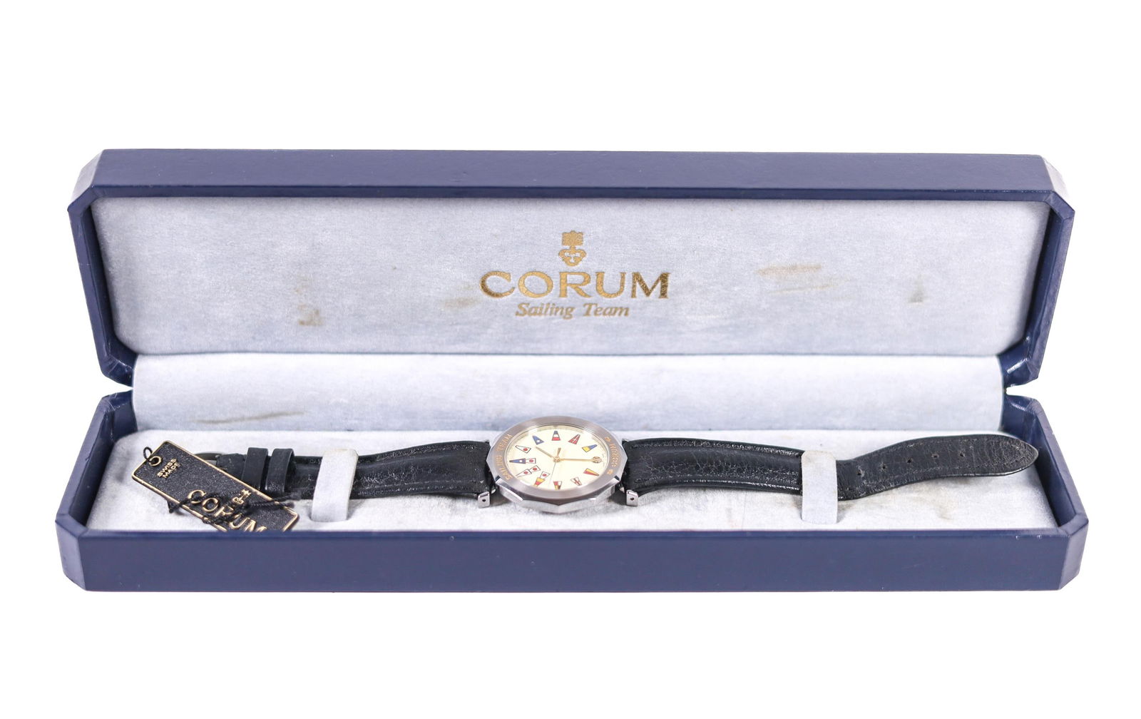 CORUM SAILING TEAM WATCH W/BOX 36MM: A Corum Sailing Team watch in good condition. This watch features a beige dial, a black leather band, and a stainless steel case. It comes with its original case. Stamped P.B., 63.800.20, 507878, Wate