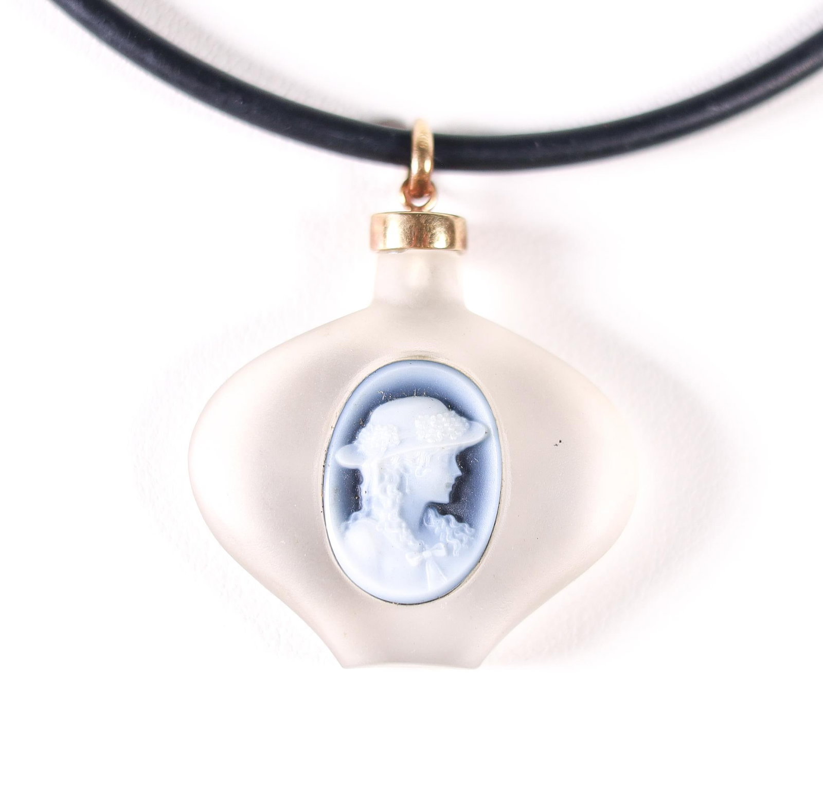 18KYG GERHARD SCHMIDT CAMEO NECKLACE: Gerhard Schmidt cameo pendant with 18-karat yellow gold and hung on a rubber necklace. Stamped K18 on the pendant's bail and the end caps of the necklace. Details and measurements: Necklace length: 30