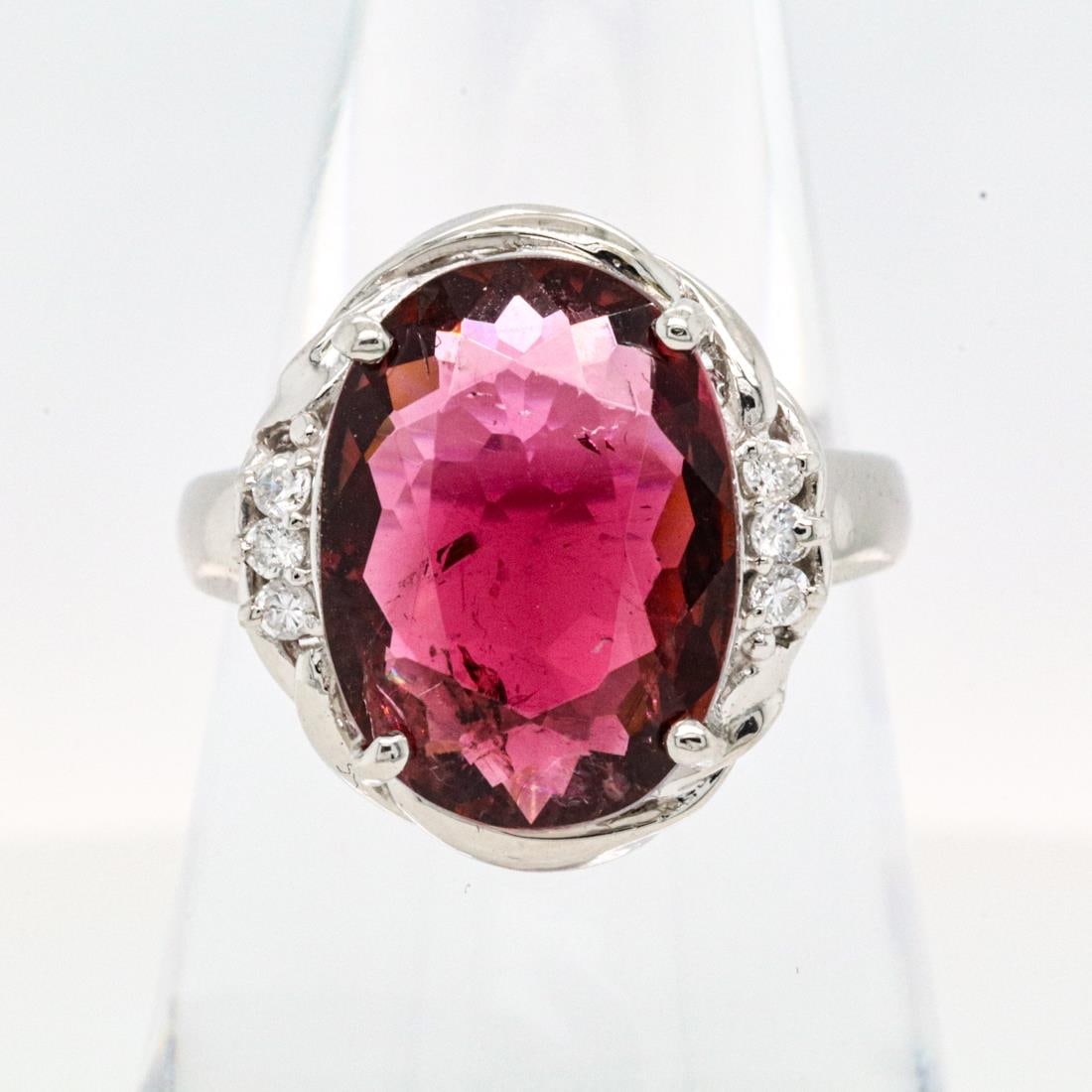 900PT 5.351CTTW TOURMALINE & DIAMOND RING, 7.5: Platinum ring with a 5.241-carat oval-cut tourmaline center stone accented by 0.11 carats of round brilliant diamonds. Stamped D011, Pt900, 5.241, on the inside of the ring band. Details and measureme