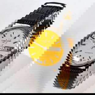 ULYSSE NARDIN AUTOMATIC YELLOW DIAL WATCH, 36MM: Ulysse Nardin Automatic yellow dial watch in excellent condition. It features a black leather band, a stainless steel case, a yellow dial, a date display, and a day display. Details and measurements: