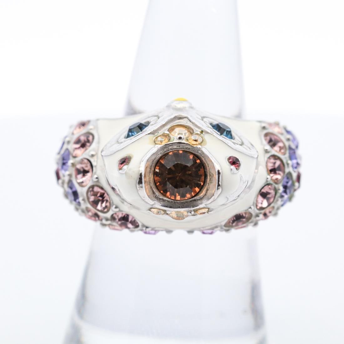 ENAMEL AND RHINESTONE OWL RING: Base metal white enamel owl ring with multicolor rhinestones. Hallmarked Anna Sui 23.5 grams