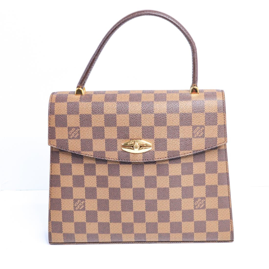 LOUIS VUITTON DAMIER MALESHERBES HANDBAG: Louis Vuitton Damier Malesherbes handbag in excellent condition. It features a handle, a flap closure, gold-toned hardware, and a checkered pattern. There is wear on the metal hardware, corners, and i