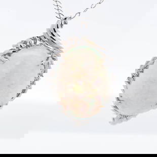 Pt900 11.26ct Opal & Diamond Pendant Necklace, 18": Centered by an impressive 11.26 ct translucent white opal showing soft pastel play-of-color, this platinum pendant is edged with round brilliant diamonds that trace a flowing, foliate-inspired frame a