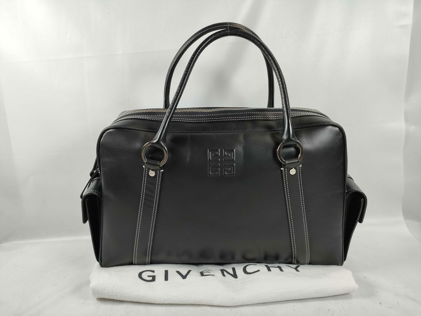 2000s Corporate Powerhouse Givenchy Black Leather Mini Handbag: It's 2004 and my mom is still a corporate powerhouse working for Pepsi-co. She lets me pick the gatorade ad for the superbowl. She has a short black pixie cut with deep brown highlights, a J Crew peti