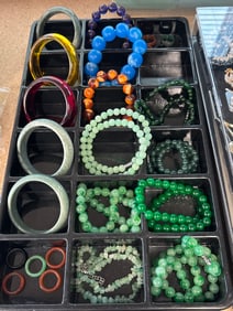 Huge group of Amber bangles and Jade, necklaces and many other things