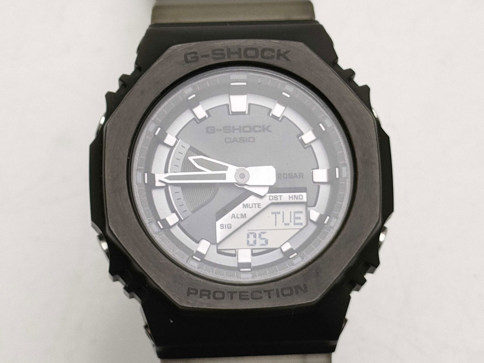 Casio G-Shock GM-S2100 Gray Octagonal Analog Digital Watch box papers everything: Casio g-shock watch, authentic. gray resin case with octagonal bezel and metallic gunmetal-tone frame. gray dial featuring both analog hands and a small digital display window at lower right showing d
