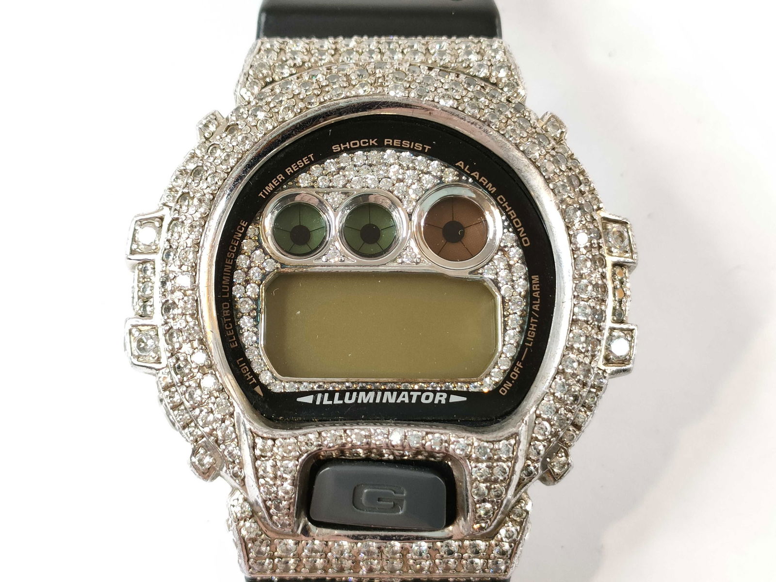 Casio G-Shock DW-6900G Custom Bezel Digital Watch: needs new battery. Casio g-shock watch, authentic. model dw-6900g featuring a striking aftermarket custom bezel set with clear rhinestones or imitation diamonds around the display and case edges. digi