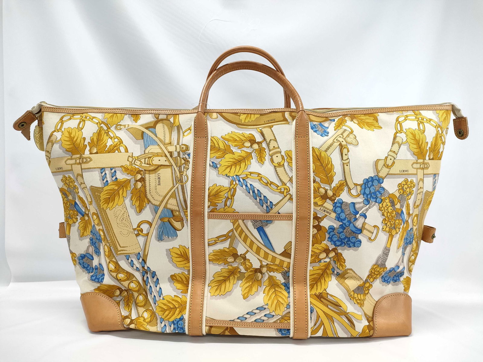 Loewe Botanical Boston Bag Duffle Bag in Canvas: Loewe Botanical Boston Bag Duffle Bag in Canvas. This super cool bag features an all around canvas pattern with fine cow leather accents. Would make a great beach tote or perhaps just an every day hau