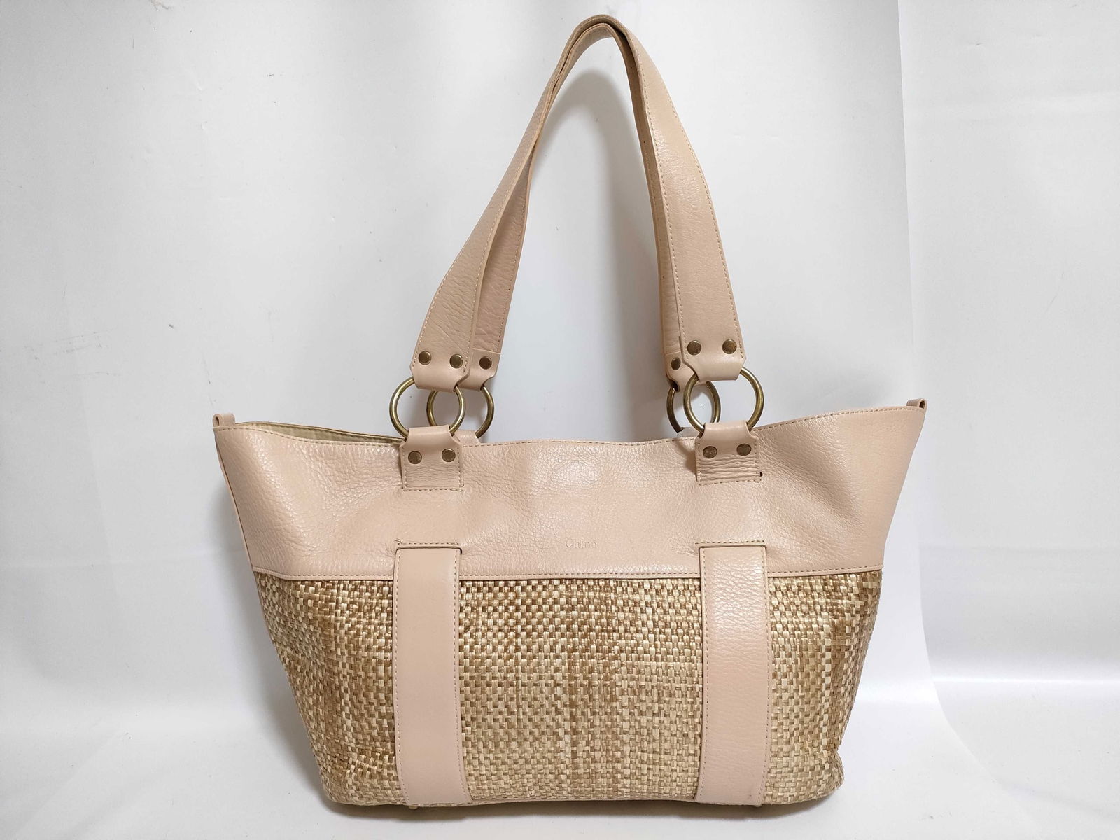 Chloe Tote Bag with Leather and and Woven Reeds: Chloe Tote Bag with Leather and and Woven Reeds. Salmon leather and look this bag has metal feet hardware, that is a sign of quality