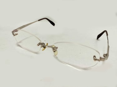 Burberry rimless eyeglasses with silver-tone metal bridge and temples