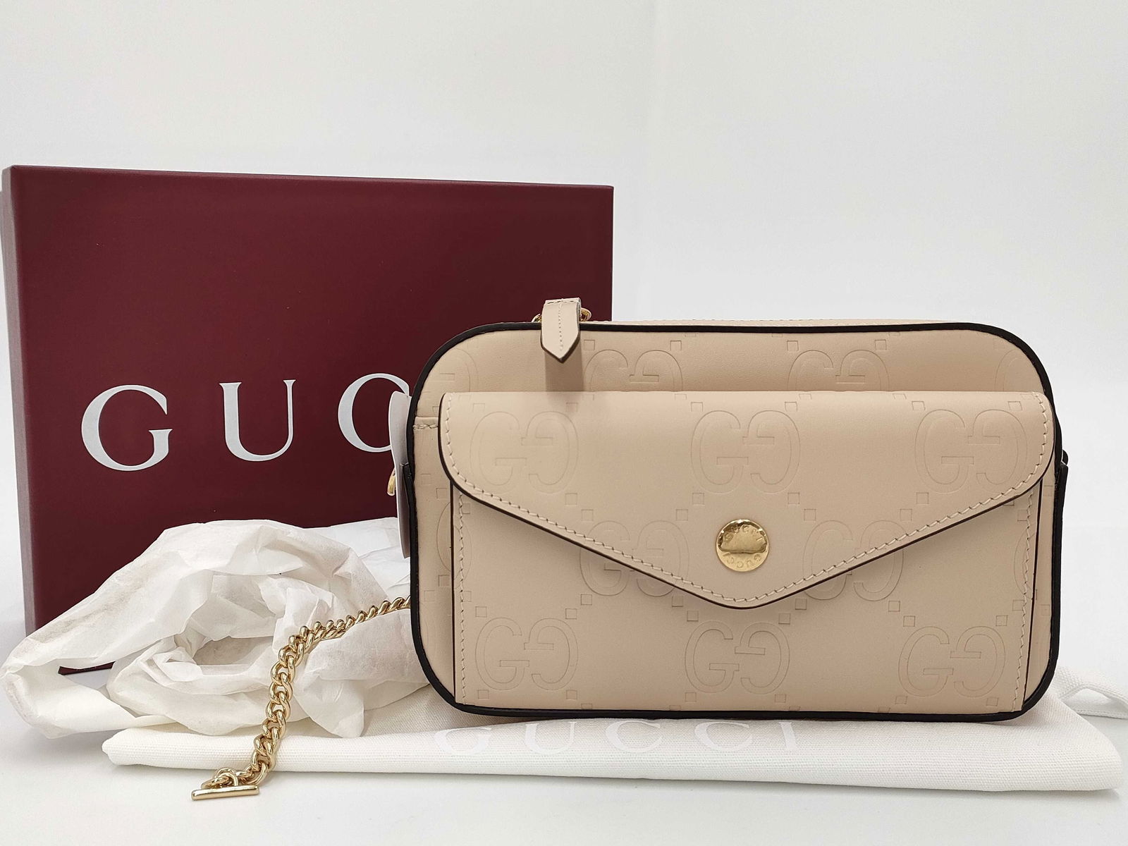 Gucci GG Chain Shoulder Bag Giftable Condition Brand New with Box Dust Bag and Strap!: Shoulder bag featuring beige leather embossed with the GG pattern and trimmed with contrasting dark edges. Designed with a front envelope-style pocket finished with a round gold-tone snap. Main compar