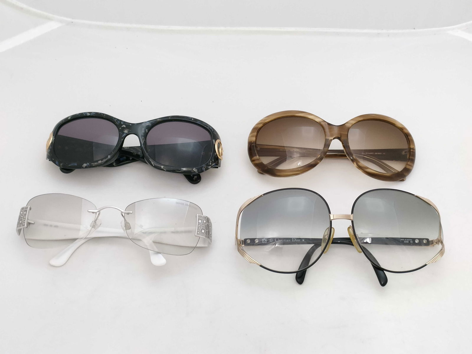 Group lot of Dior, Swarovski , Jill Stuart sunglasses: Summary set of four sunglasses , by Dior, Swarovski , Jill Stuart , as shown . you get all pictured