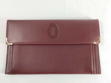 Cartier Must de Cartier leather pouch in bordeaux leather.
