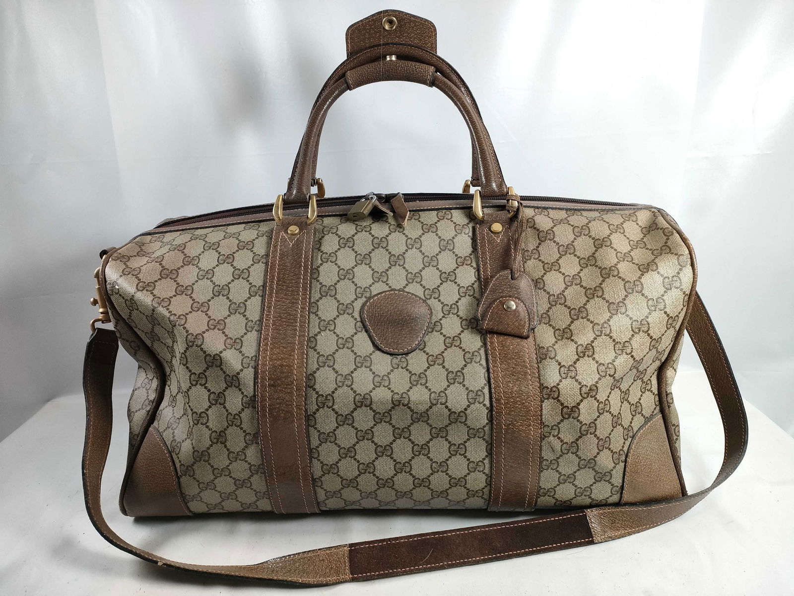 Gucci GG Canvas & Leather Boston WAY Boston Bag: Authentic Gucci GG Canvas & Leather Boston bag having beige GG canvas featuring brown leather trim, rolled leather top handles, and detachable shoulder strap. Exterior featuring leather corner pan
