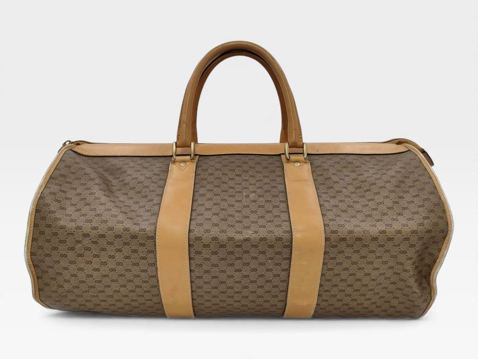 Vintage Gucci brown monogram canvas duffle bag 55cm with lock & keys: Authentic vintage Gucci brown monogram canvas duffle bag with cowhide leather trim and dual grip handles. 55cm with lock & keys. Very good condition.