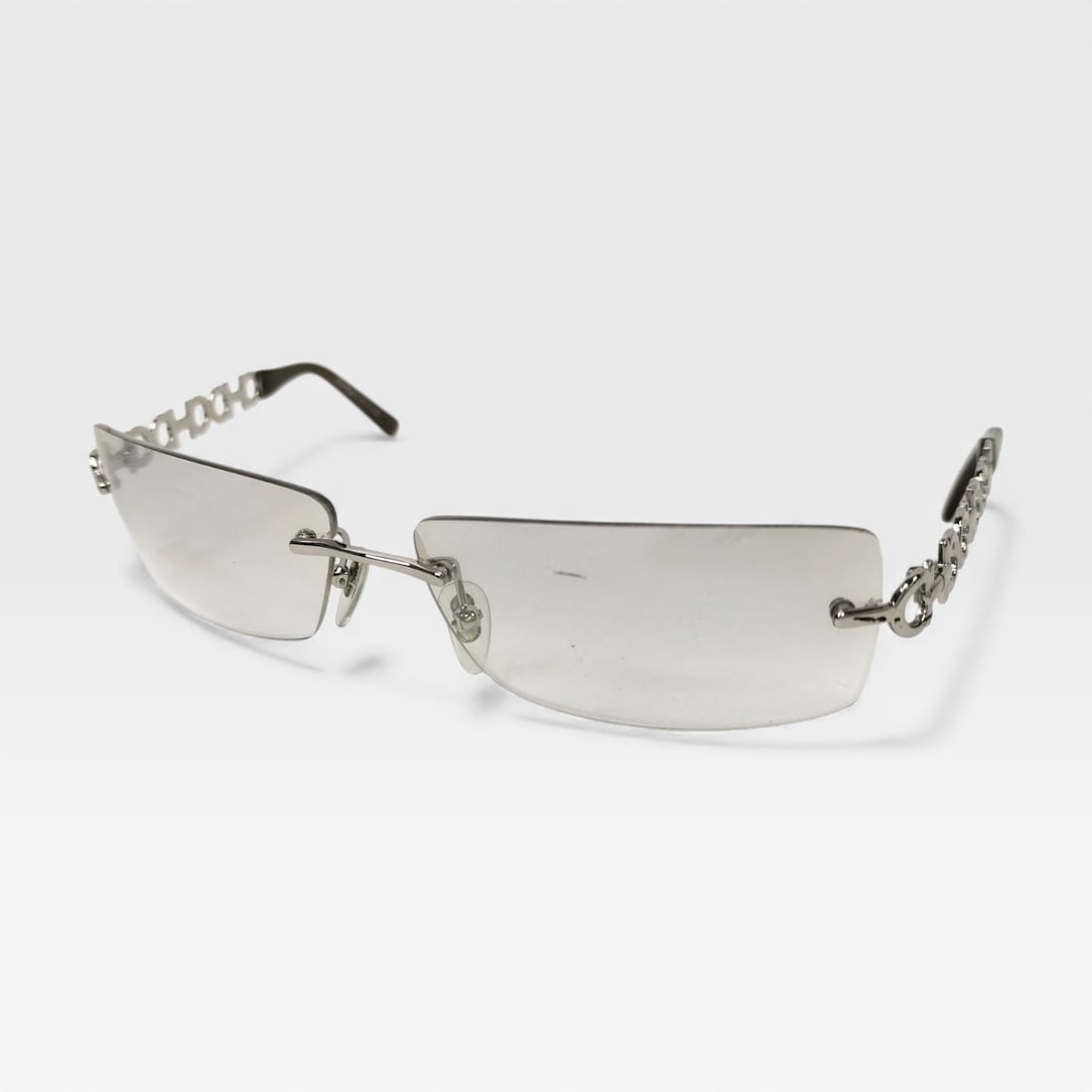 Salvatore Ferragamo Gancini Palladium Tone Sunglasses: Authentic Salvatore Ferragamo palladium tone Gancini pattern rectangular smoky gradient lenses.