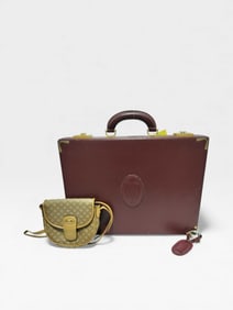 Cartier Bordeaux Leather Trunk with Gilt Metal Hardware and this broken Celine bag we found in the