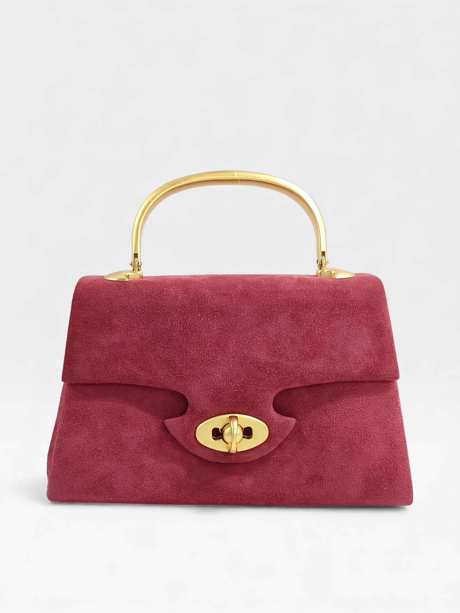 Incredible Vintage Givenchy Suede Top Handle Bag: Authentic Vintage Givenchy Suede Top Handle Bag in rosey suede with brushed warm gold hardware. Look at the shape of this. How fun and unique. And it's in excellent conditon too.