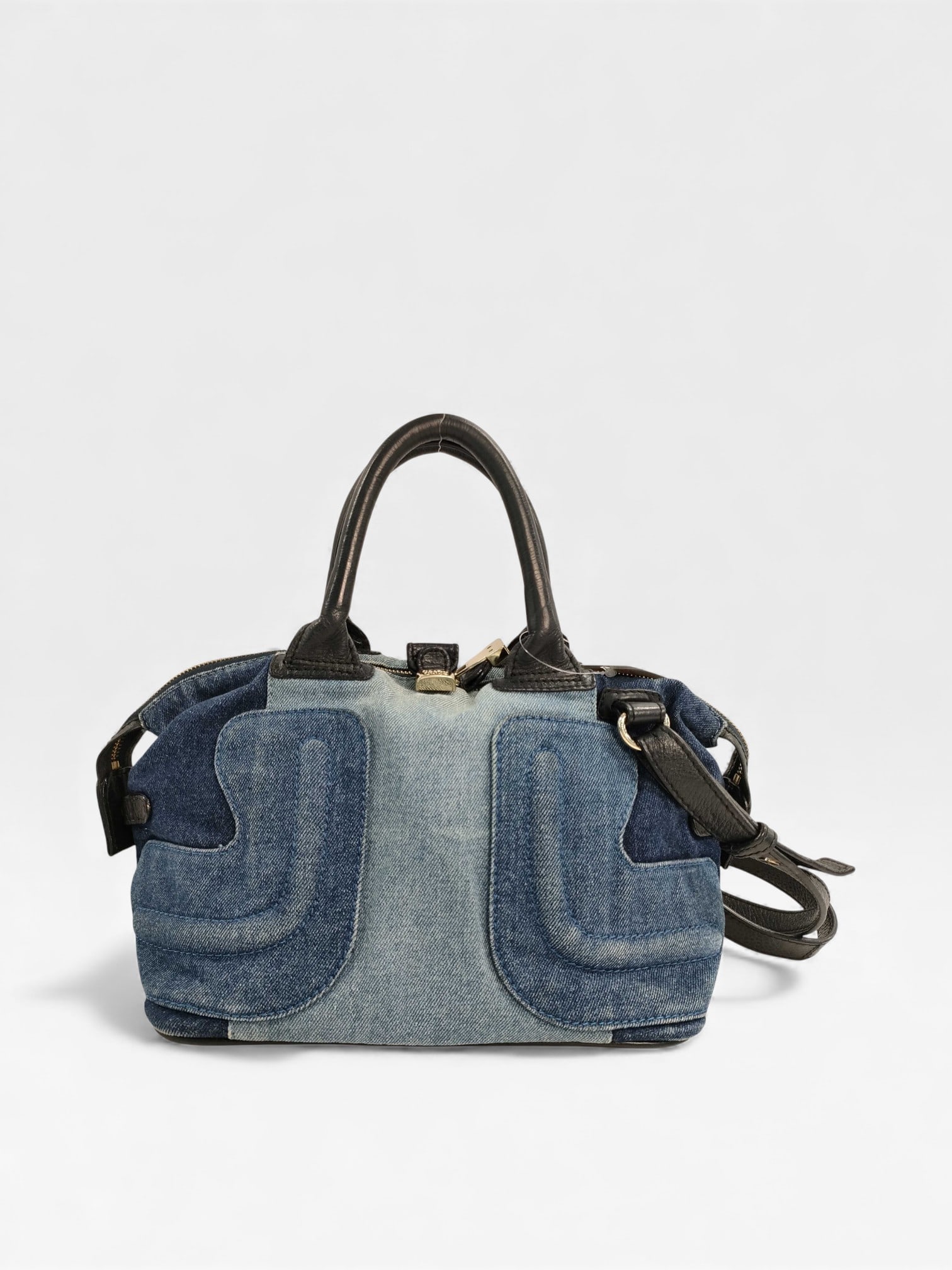 See by Chloé Denim & Leather 2-Way Satchel: Authentic See by Chloé denim satchel or bowler bag featuring a blue denim exterior with contrasting dark leather top handles and trim. In very good condition! The bag includes large, stylized "pocket