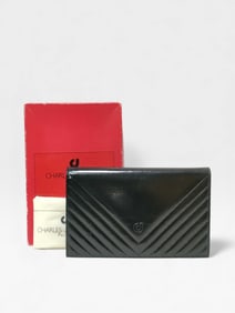 Vintage Charles Jourdan black leather clutch bag.
