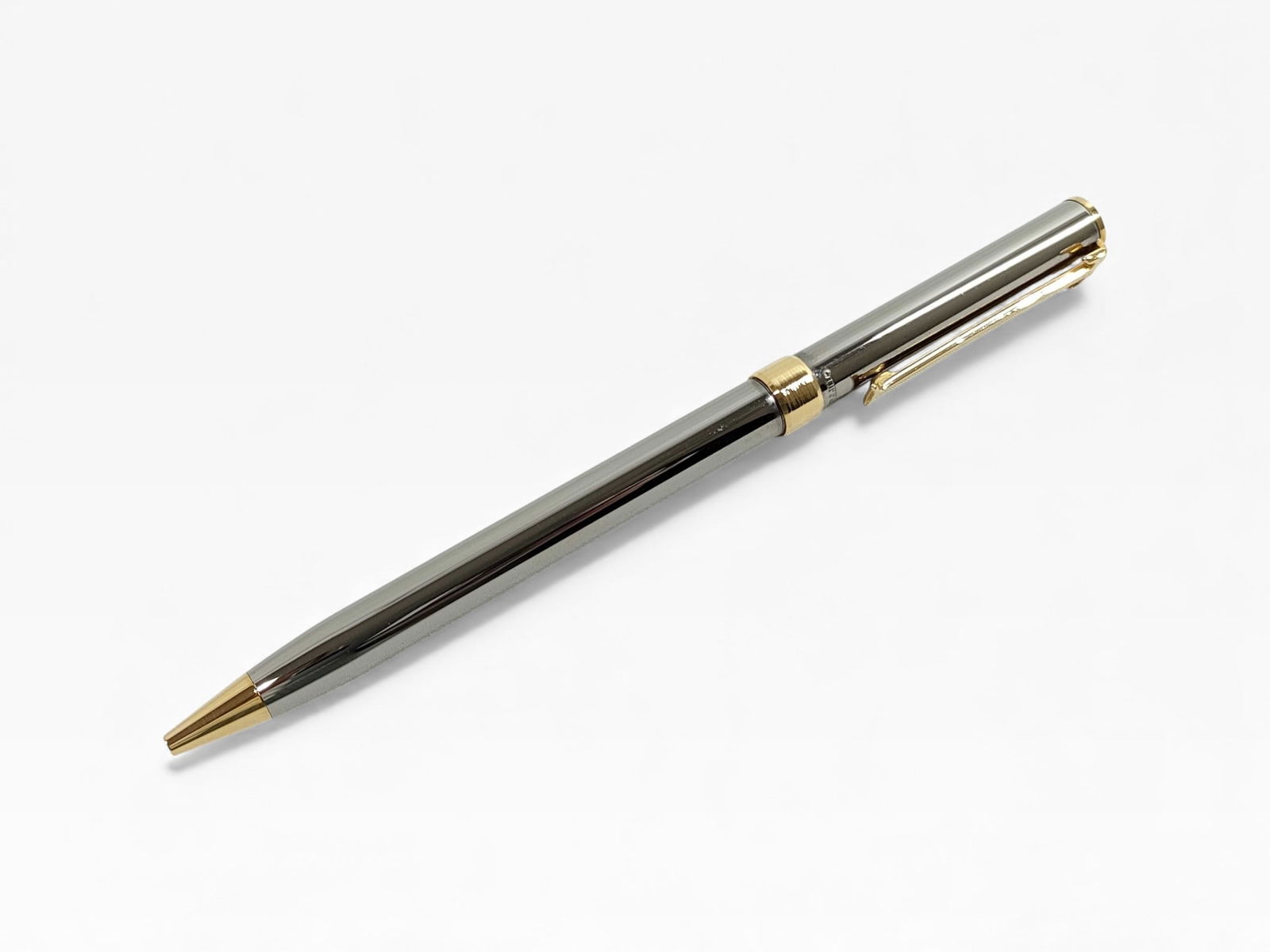 Tiffany & Co. Ballpoint Pen: Tiffany & Co. Ballpoint Pen stainless steel with gold plated accents. Pen writes currently but will need new ink eventually.