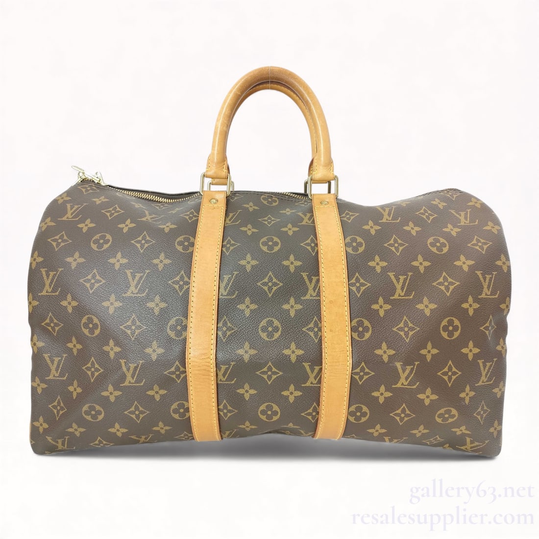 Louis Vuitton Monogram Keepall 45: Very good condition. Authentic Louis Vuitton Monogram Keepall 45. Travel bag featuring brown monogram canvas with natural vachetta leather handles and trim. Designed in the classic cylindrical Keepall